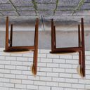 The profile of a pair of chairs. With the photo flipped upside down they read as forty four in a geometric font.