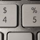 Close up photo picture of a Mac keyboard. Cropped in close to include the four and five keys only.